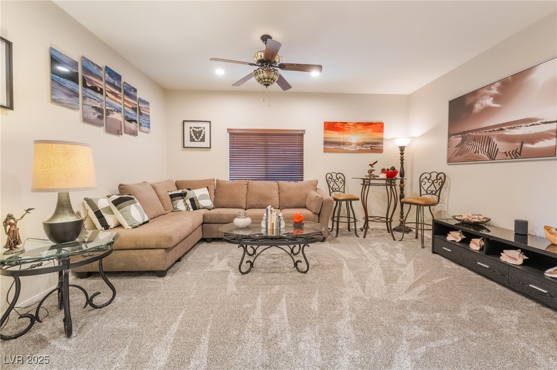 4732 Adriano Way Pahrump, NV 89061 - Photo 7 of 44 Living area with carpet flooring, recessed lighting, and a ceiling fan