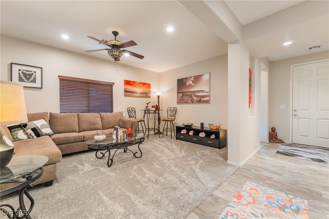 4732 Adriano Way Pahrump, NV 89061 - Photo 8 of 44 Living room featuring wood finished floors, recessed lighting, and a ceiling fan