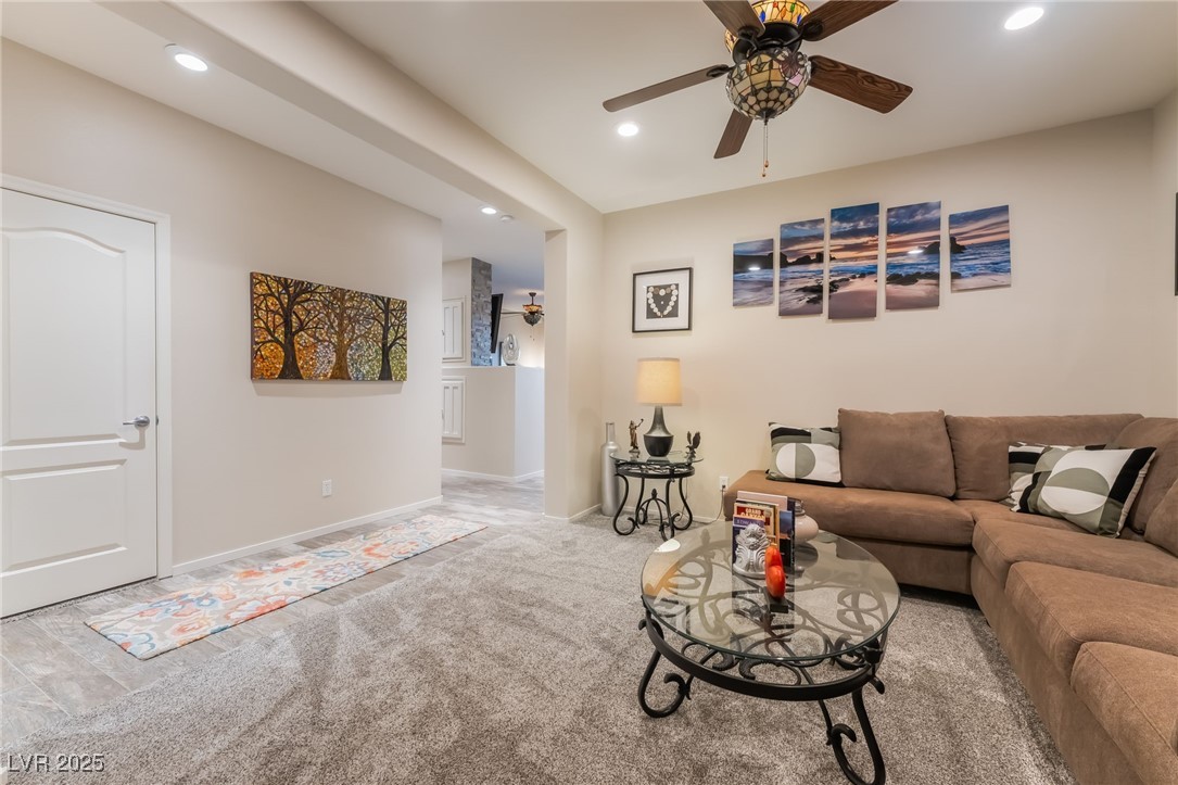4732 Adriano Way Pahrump, NV 89061 - Photo 9 of 44 Living room with recessed lighting, a ceiling fan, and carpet