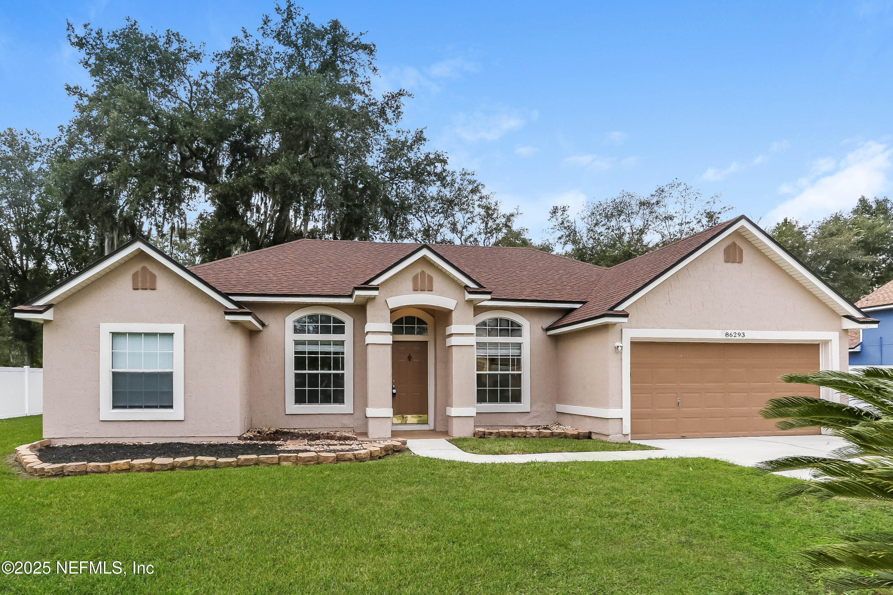 86293 Fieldstone Drive Yulee, FL 32097 - Photo 1 of 15 front view of a house with a yard
