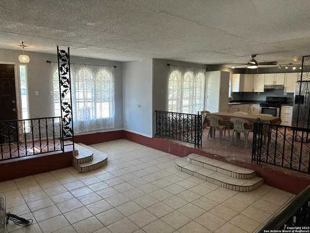 a lobby with furniture and window