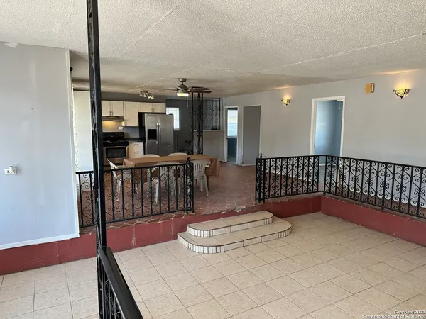 a view of a hallway with seating area