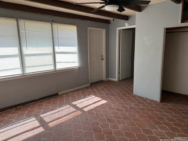 a view of an empty room and window
