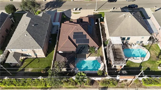 an aerial view of houses with outdoor space