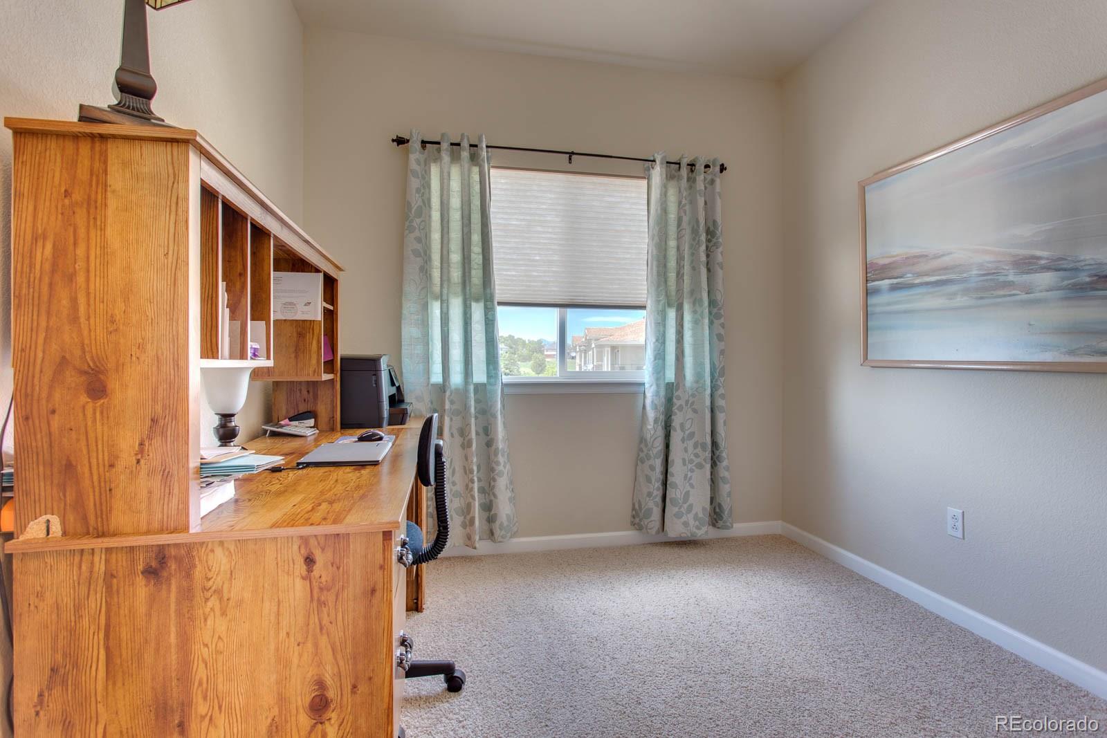 6292 Kilmer Loop, Unit 204 Arvada, CO 80403 - Photo 18 of 25 a view of a livingroom with furniture and staircase