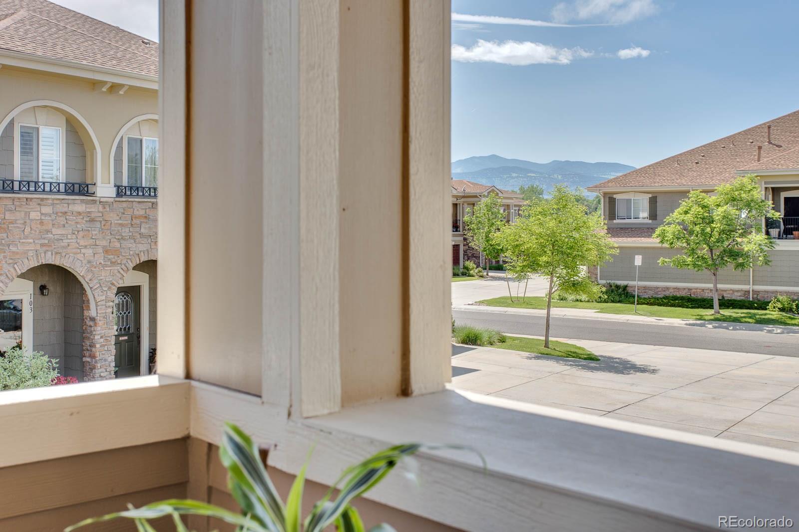 6292 Kilmer Loop, Unit 204 Arvada, CO 80403 - Photo 22 of 25 a view of house with yard and garden
