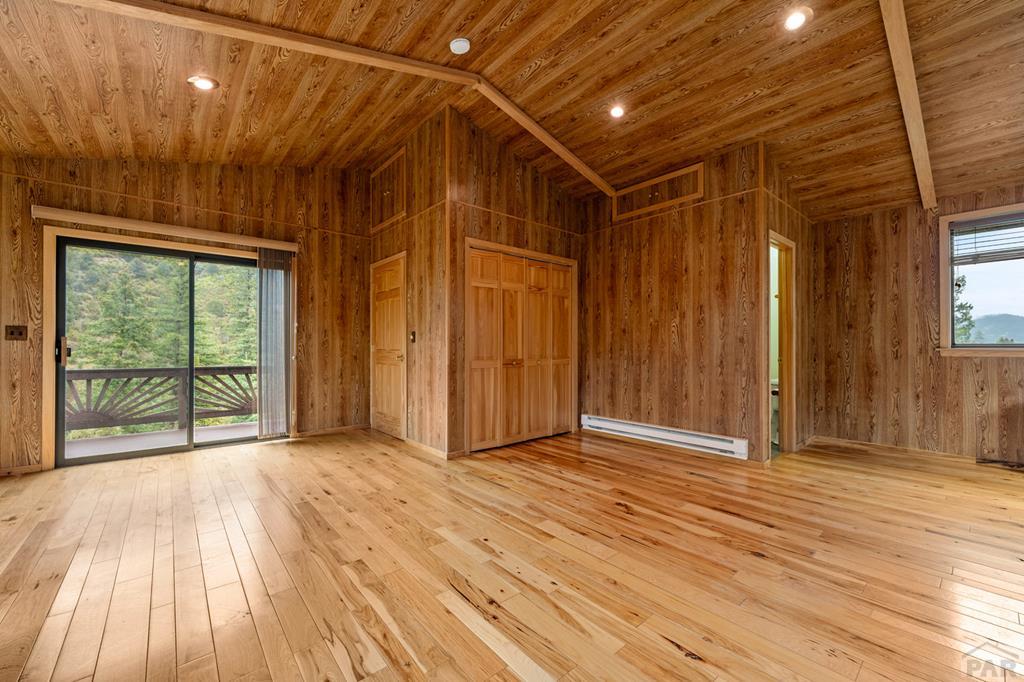 9600 Middle Creek Canyon Road Beulah, CO 81023 - Photo 35 of 50 a view of an empty room with wooden floor and a window