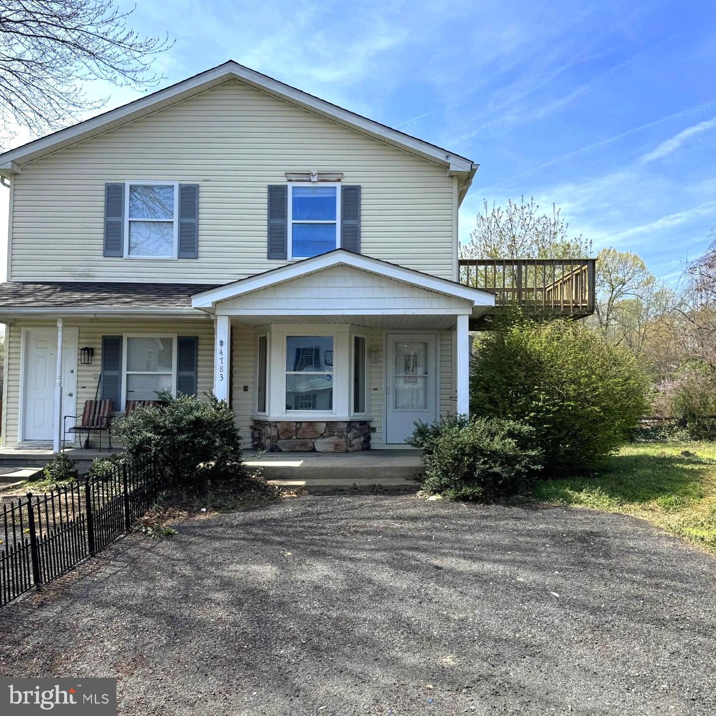 4783 Calvert Drive St. Leonard, MD 20685 - Photo 1 of 7 a front view of a house with garden and porch