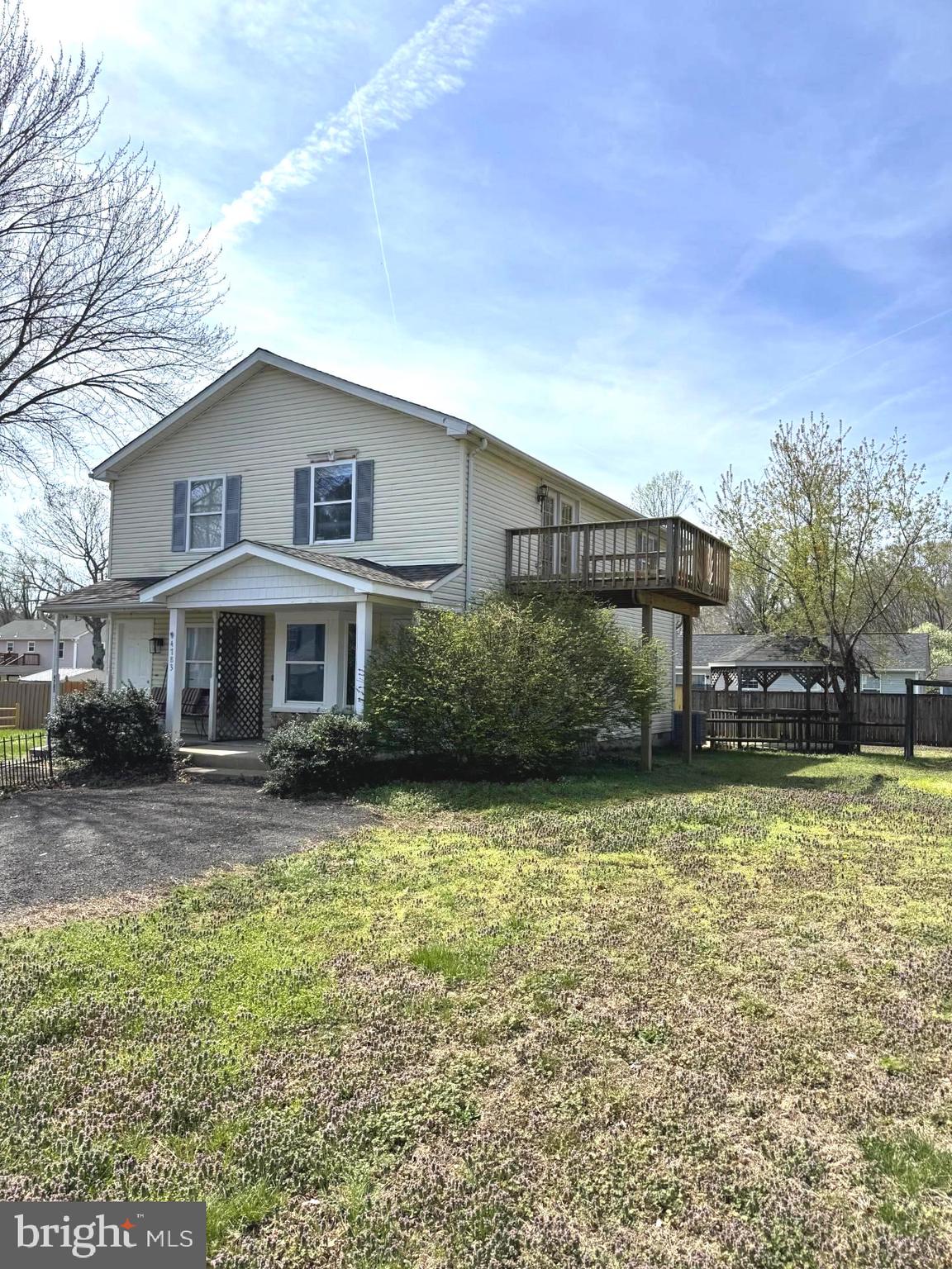 4783 Calvert Drive St. Leonard, MD 20685 - Photo 2 of 7 a front view of a house with a yard