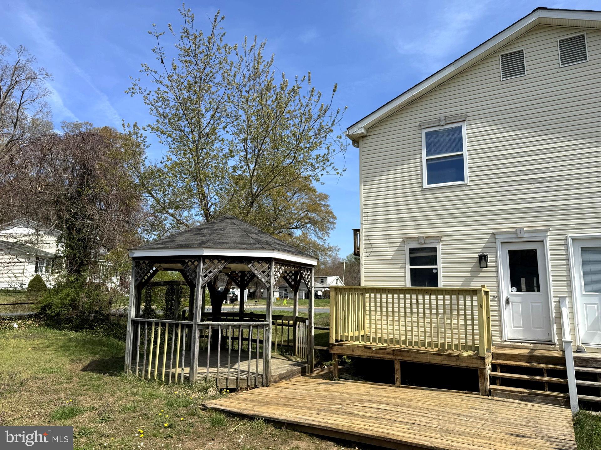 4783 Calvert Drive St. Leonard, MD 20685 - Photo 3 of 7 a view of a house with a deck