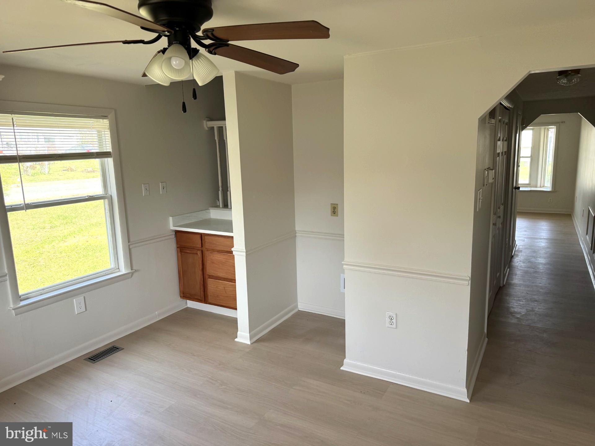 4783 Calvert Drive St. Leonard, MD 20685 - Photo 5 of 7 en empty room with window and wooden floor