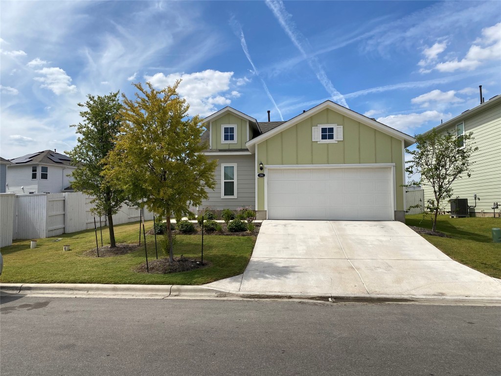 194 Heritage Ml Trail Elgin, TX 78621 - Photo 1 of 25 a front view of a house with a yard