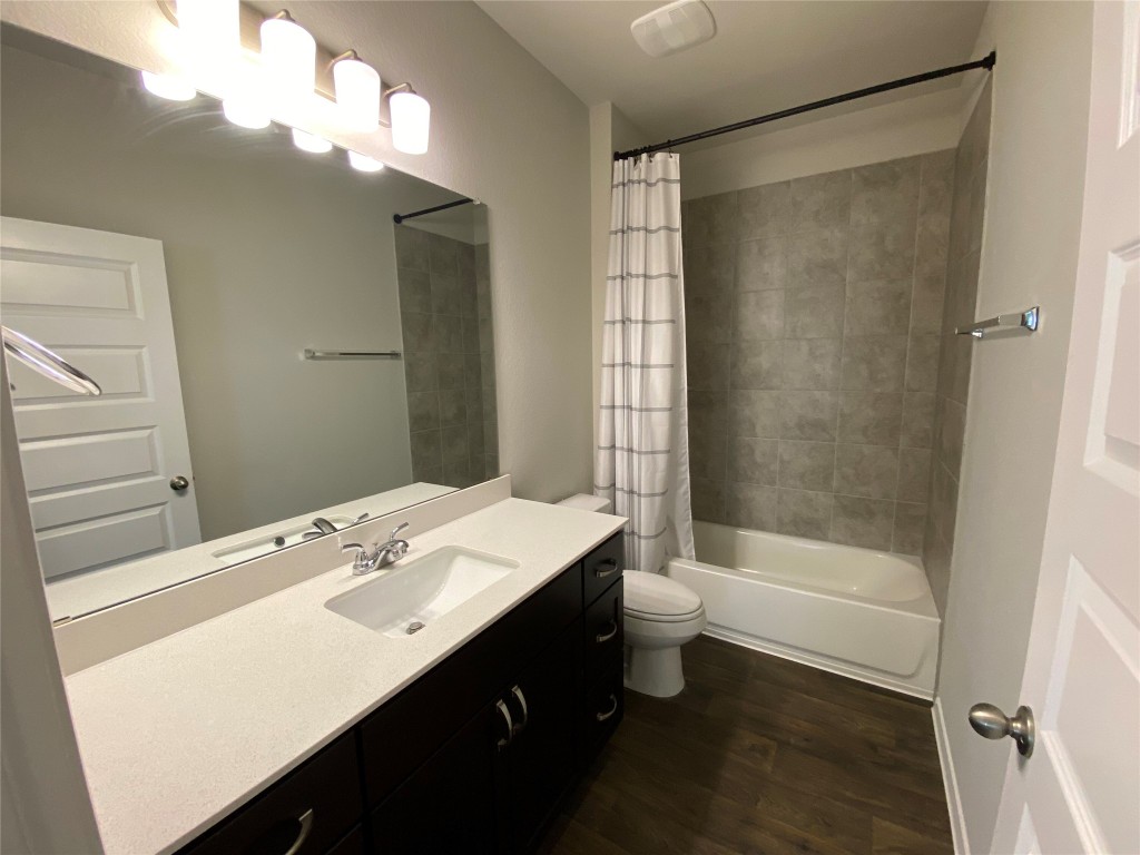 194 Heritage Ml Trail Elgin, TX 78621 - Photo 13 of 25 a bathroom with a bathtub a sink and a shower