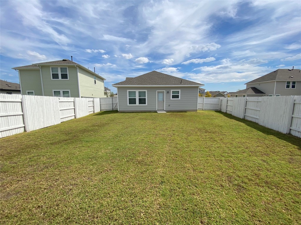 194 Heritage Ml Trail Elgin, TX 78621 - Photo 14 of 25 a view of a house with a yard