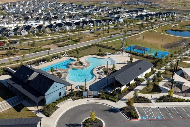an aerial view of a house with outdoor space