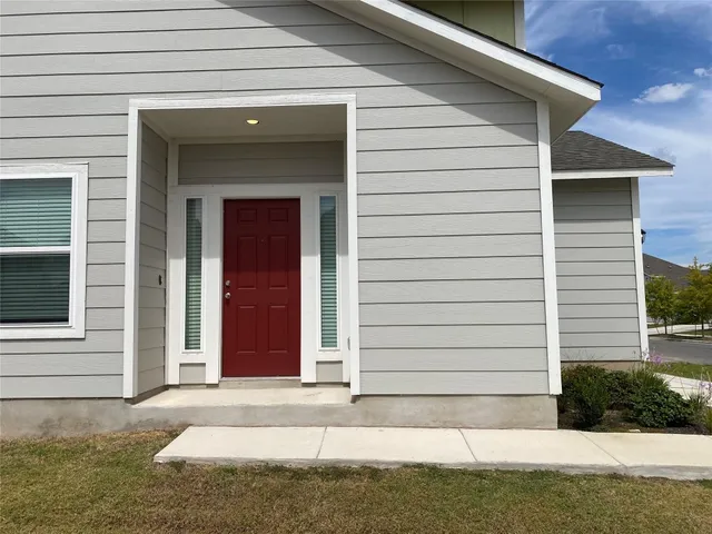 a view of a house with small yard