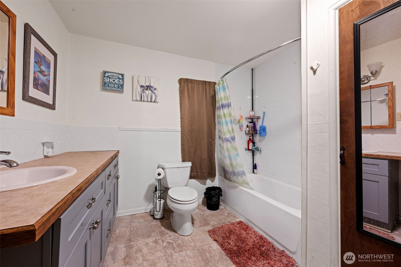 1218 Cedar Street Raymond, WA 98577 - Photo 20 of 31 a bathroom with a granite countertop sink toilet and shower