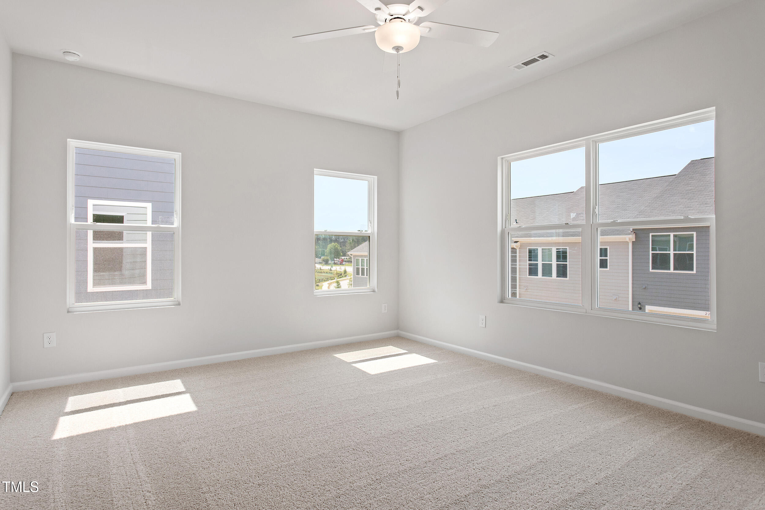 123 Powell Townes Way, Unit 302 Raleigh, NC 27603 - Photo 21 of 44 a view of an empty room with a window