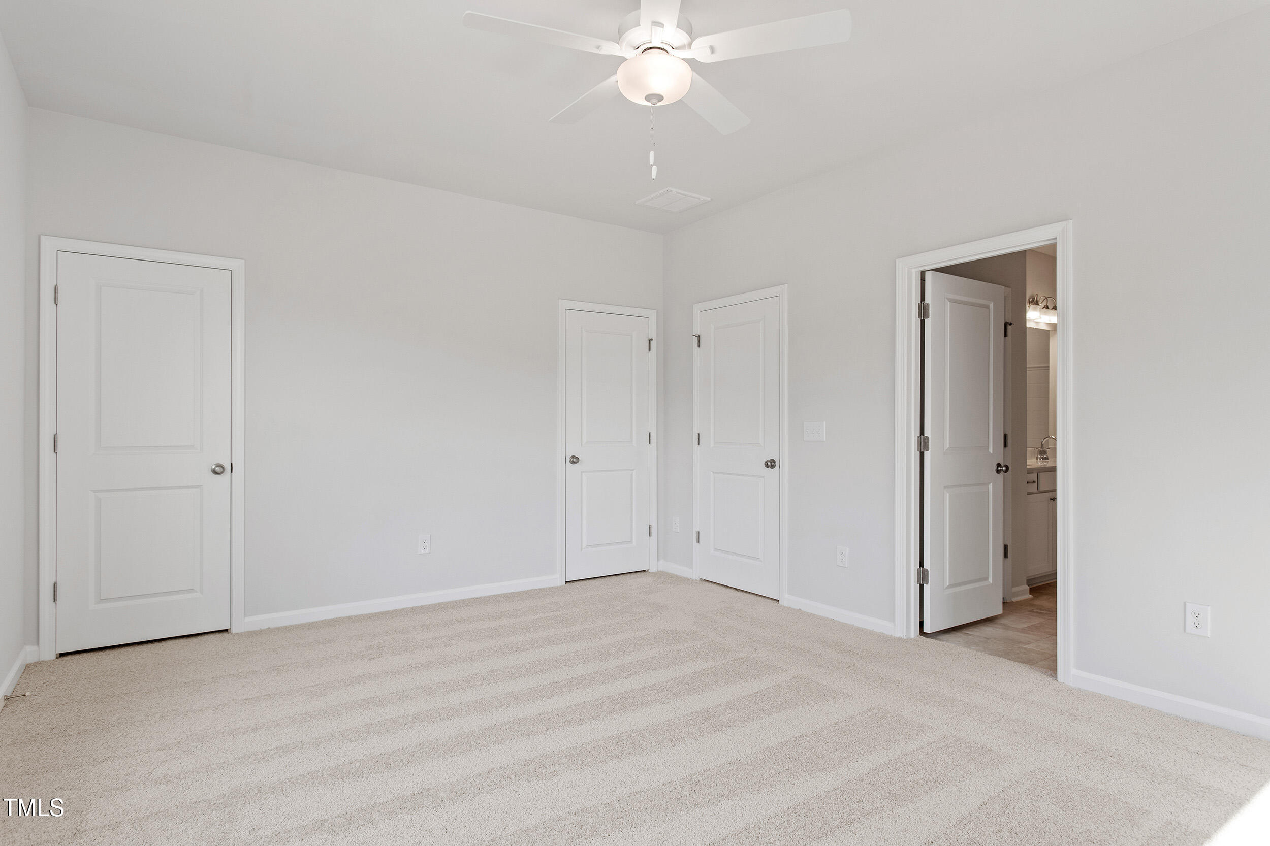 123 Powell Townes Way, Unit 302 Raleigh, NC 27603 - Photo 22 of 44 a view of a room with a ceiling fan and shower