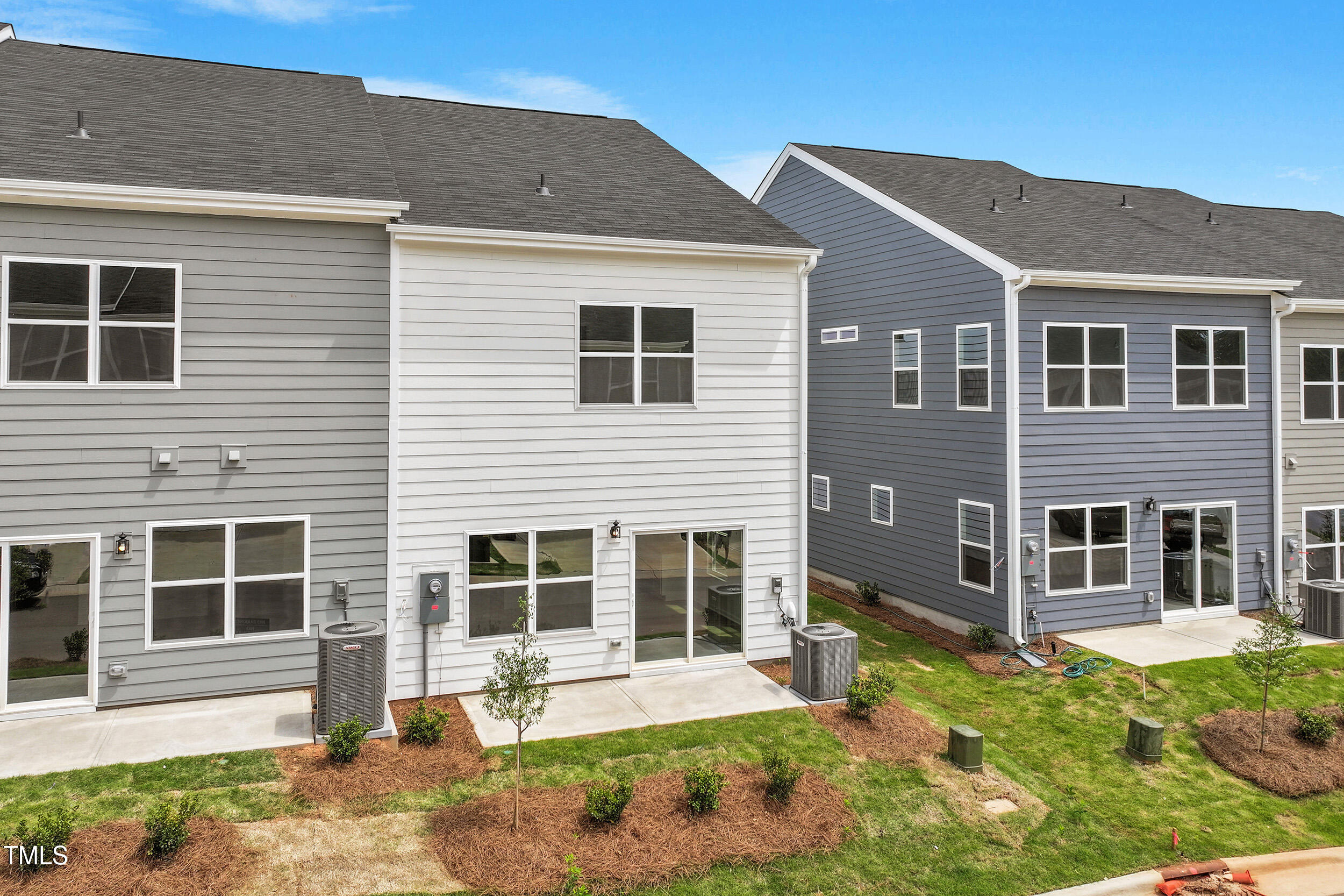 123 Powell Townes Way, Unit 302 Raleigh, NC 27603 - Photo 30 of 44 a front view of a house with a yard