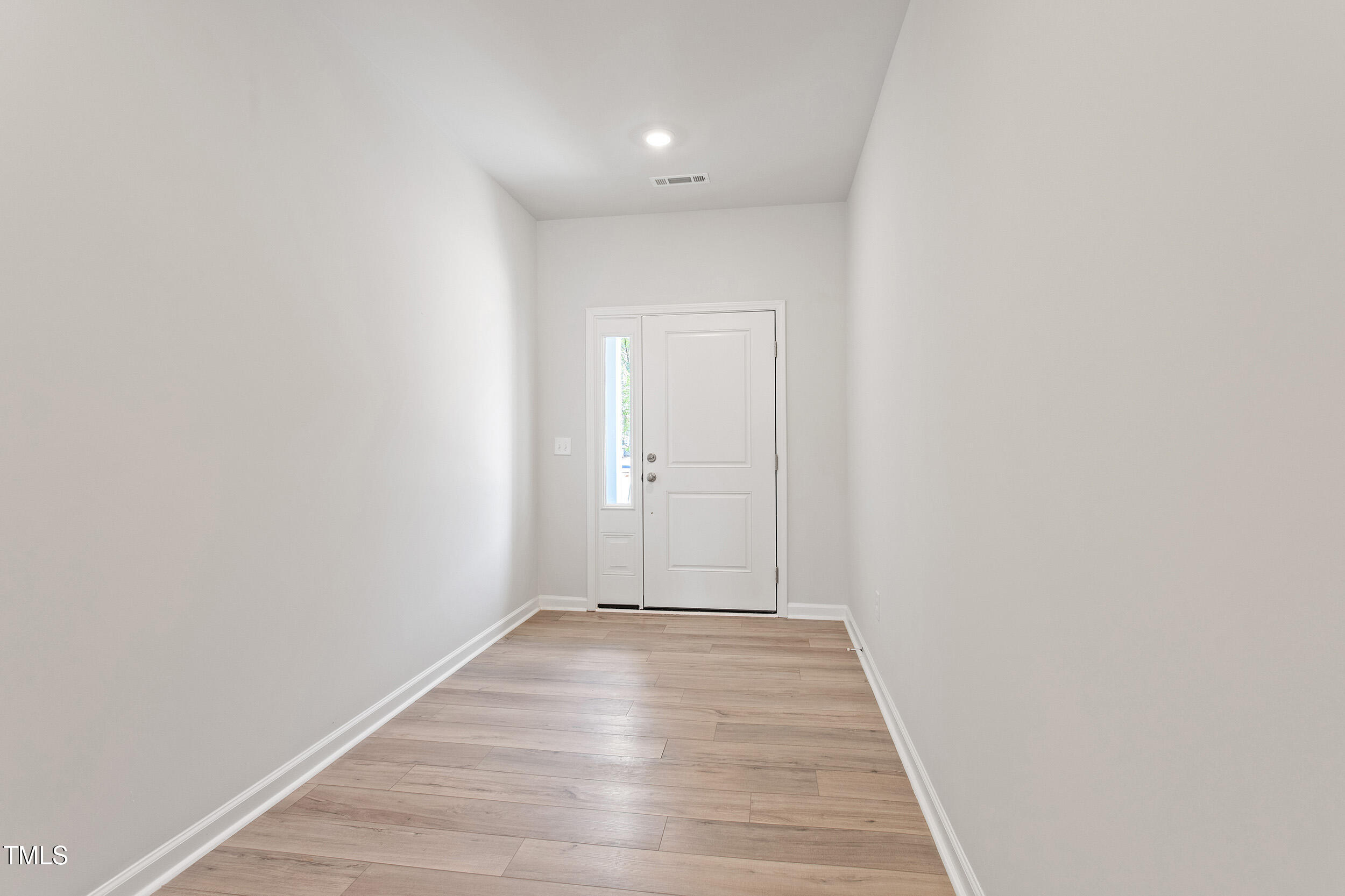 123 Powell Townes Way, Unit 302 Raleigh, NC 27603 - Photo 5 of 44 a view of an empty room