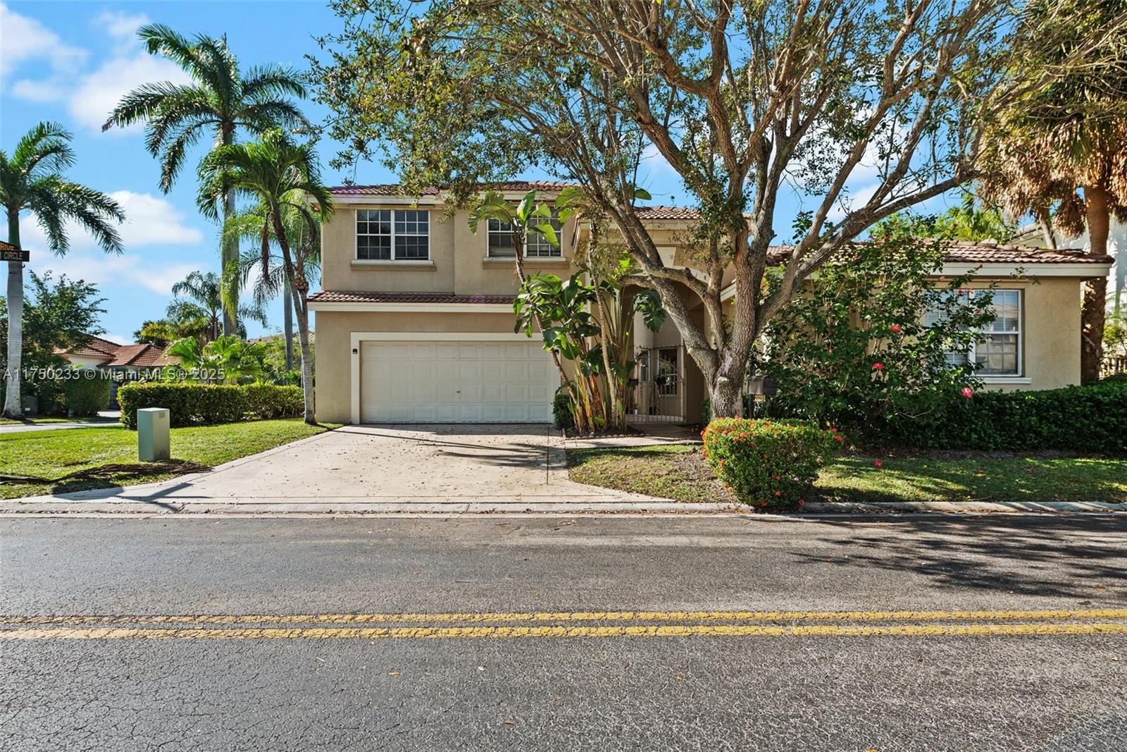 a house with a yard and large trees