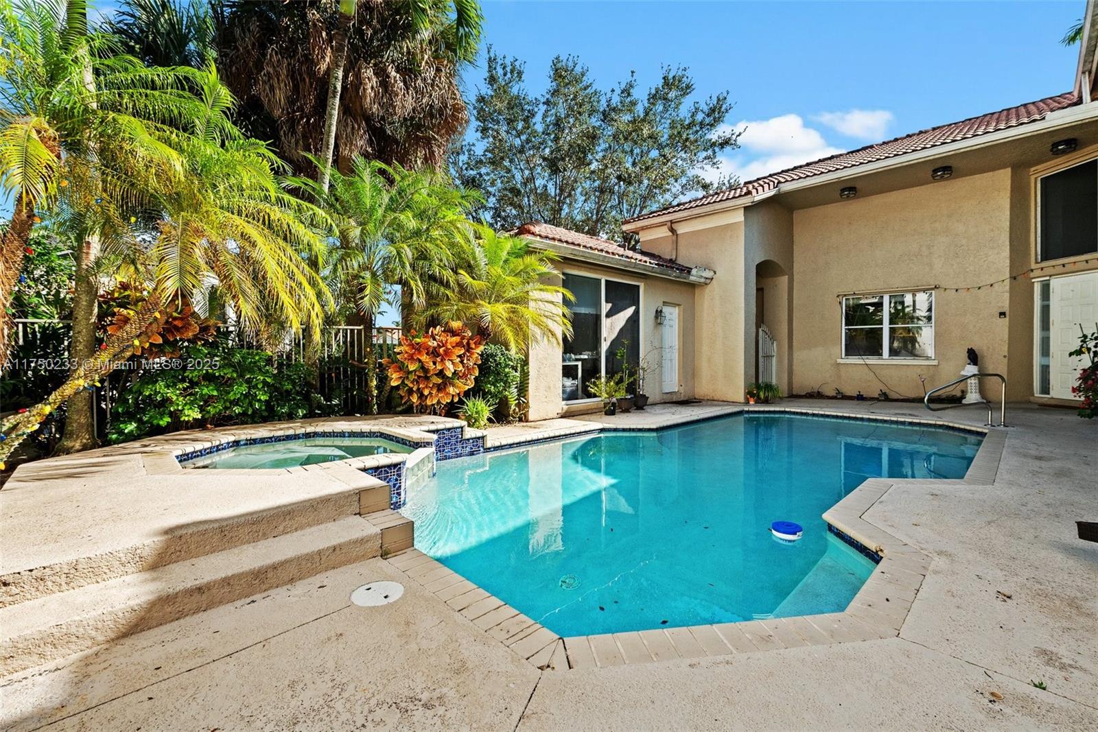 Mission Bay Boca Raton, FL 33498 - Photo 5 of 13 a view of a swimming pool with a patio