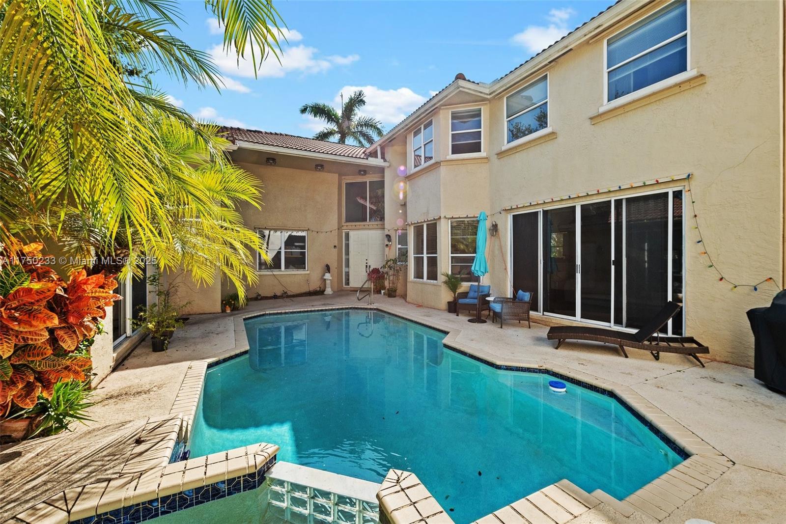 Mission Bay Boca Raton, FL 33498 - Photo 6 of 13 a swimming pool with outdoor seating yard and patio