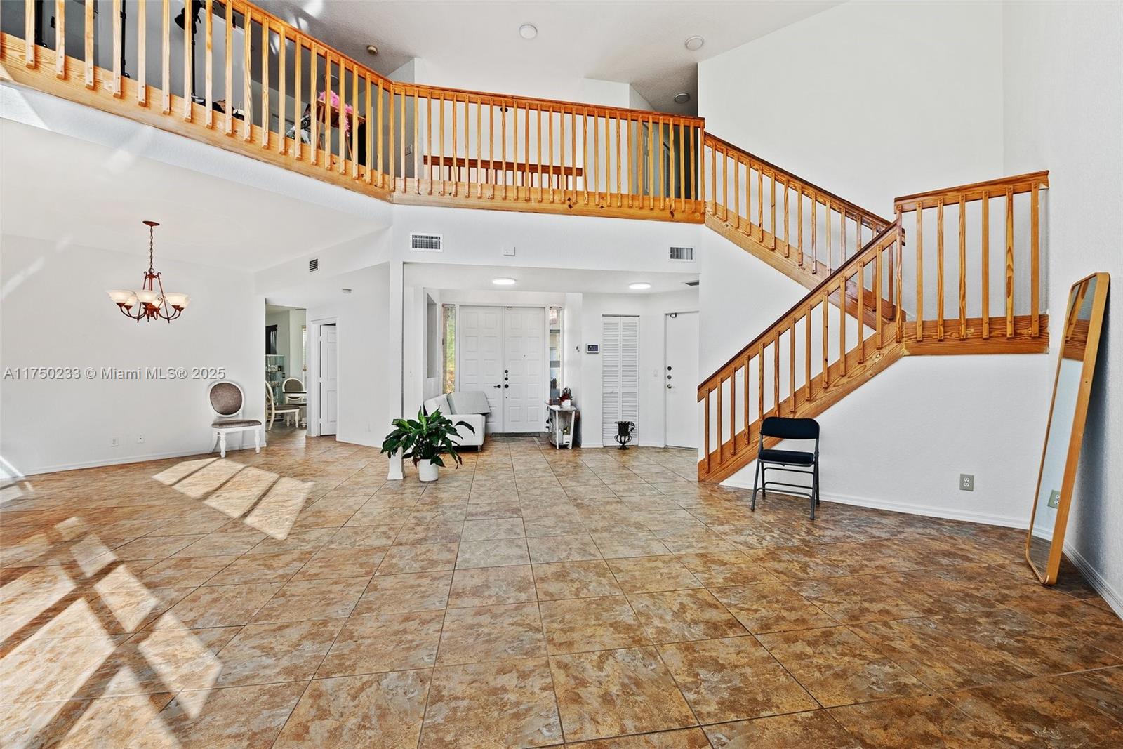 Mission Bay Boca Raton, FL 33498 - Photo 7 of 13 a view of a hallway with entryway and hall