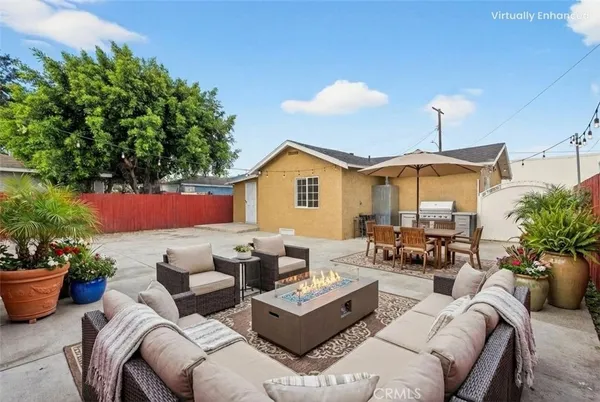 a outdoor living space with furniture potted plant and a potted plant
