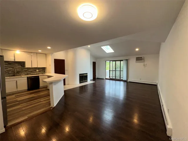 a view of kitchen with cabinets and wooden floor