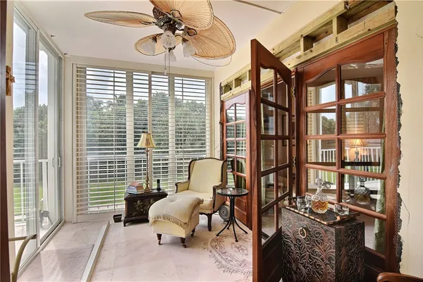 a bedroom with furniture and a window