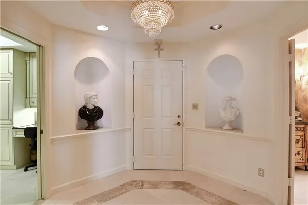 a view of entryway with chandelier