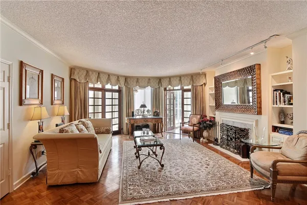 a living room with furniture rug and window