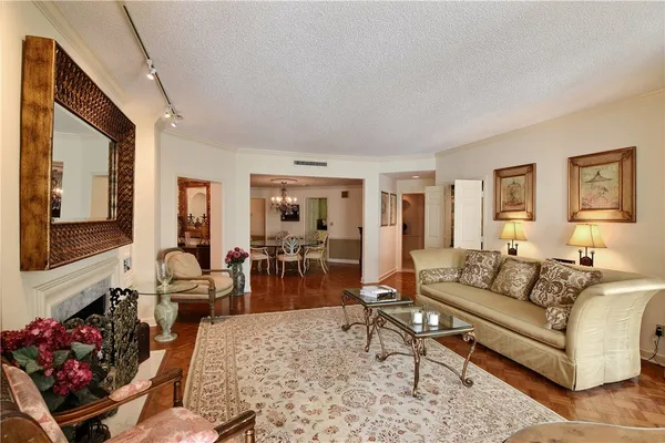 a living room with furniture fireplace and a flat screen tv
