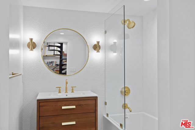 a view of a livingroom with shelves