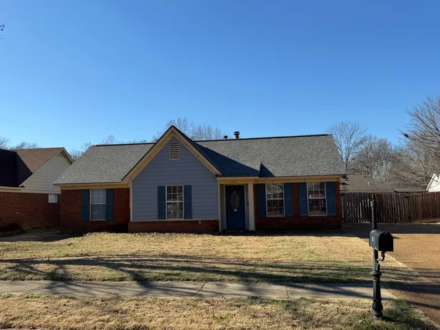 a house with trees in the background