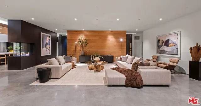 a living room with fireplace furniture and a flat screen tv
