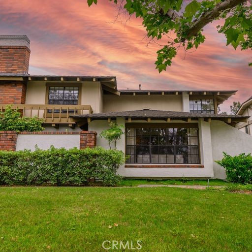 28 East Yale Loop, Unit 22 Irvine, CA 92604 - Photo 1 of 1 a view of a house with a garden and plants
