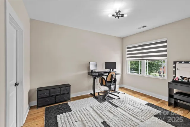 a workspace with furniture hardwood and a window