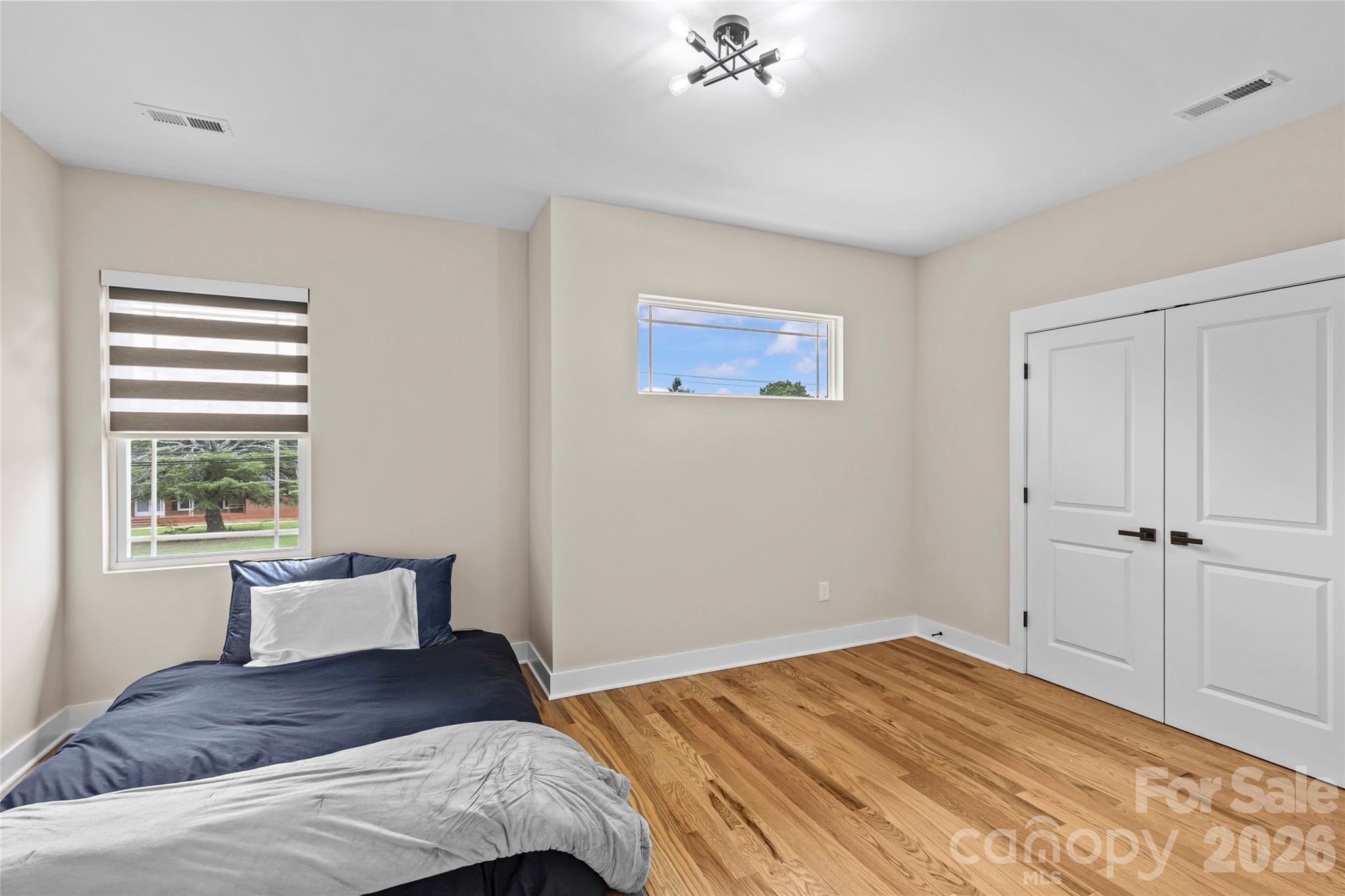 8925 Harrisburg Road Charlotte, NC 28215 - Photo 24 of 37 a bedroom with a bed and a window