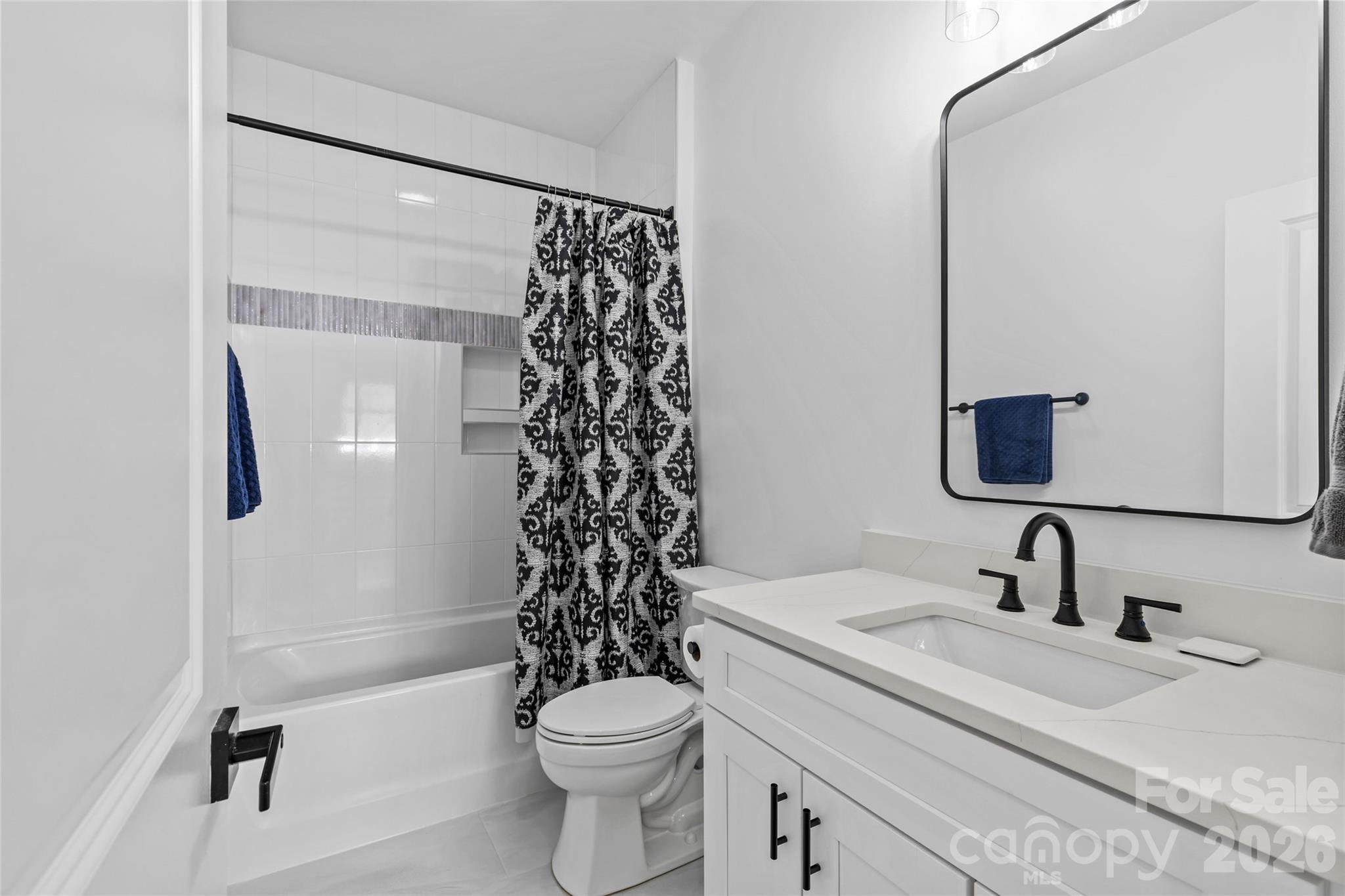 8925 Harrisburg Road Charlotte, NC 28215 - Photo 29 of 37 a bathroom with a sink toilet and shower