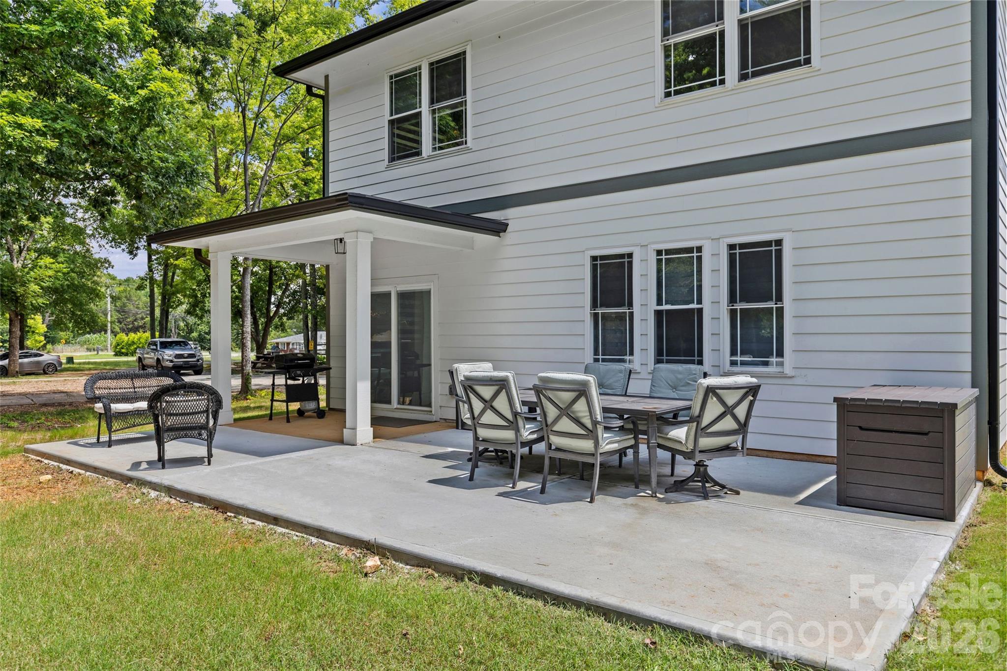 8925 Harrisburg Road Charlotte, NC 28215 - Photo 34 of 37 a view of a house with patio and a backyard