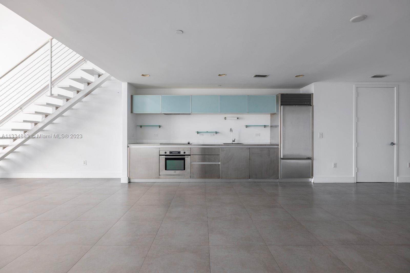 1040 Biscayne Boulevard, Unit 2402 Miami, FL 33132 - Photo 11 of 25 a view of a kitchen with a sink