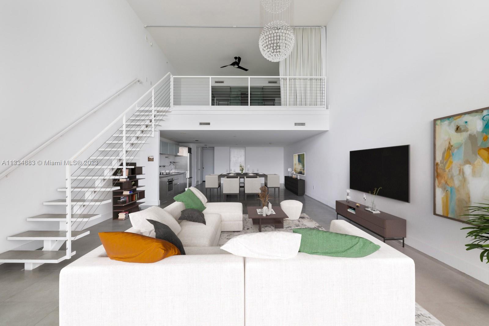 1040 Biscayne Boulevard, Unit 2402 Miami, FL 33132 - Photo 5 of 25 a living room with furniture and a flat screen tv