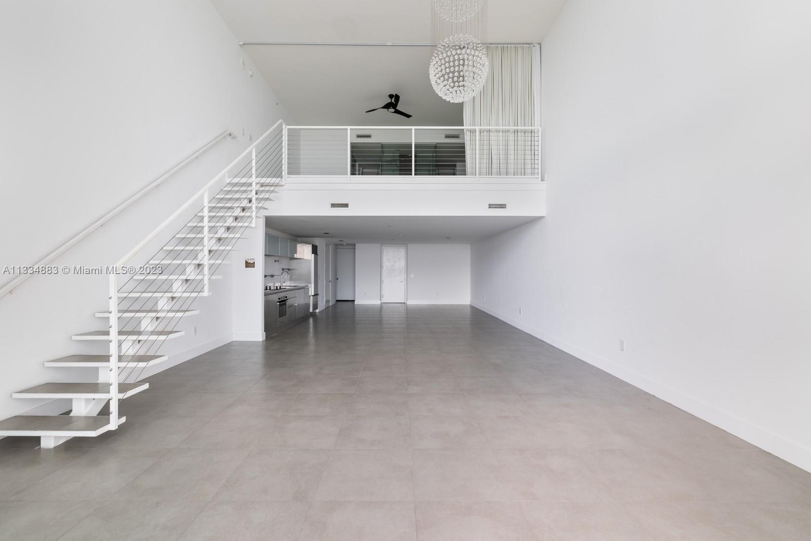 1040 Biscayne Boulevard, Unit 2402 Miami, FL 33132 - Photo 7 of 25 a view of a room with stairs