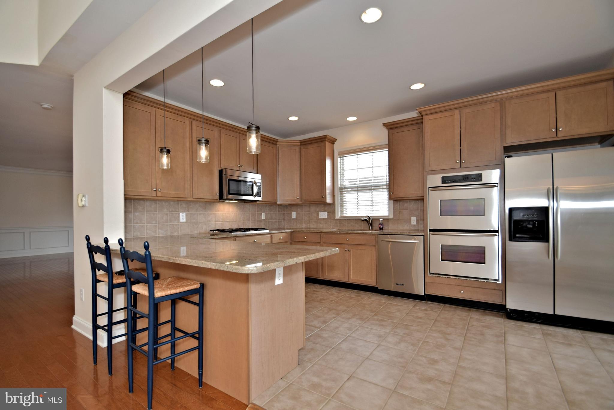 10 Wellington Road Newtown, PA 18940 - Photo 8 of 24 Breakfast bar with pendant lighting