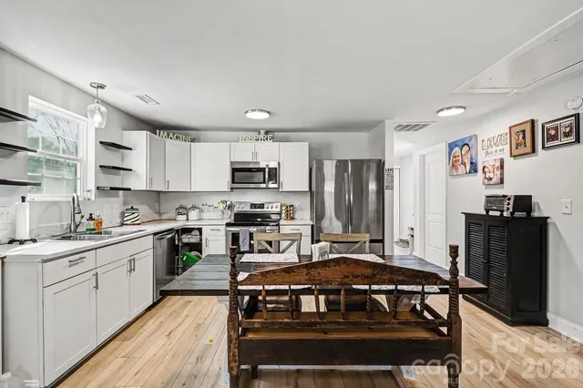 a view of a livingroom with wooden floor