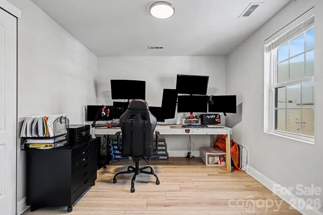 a view of a workspace with furniture and toys
