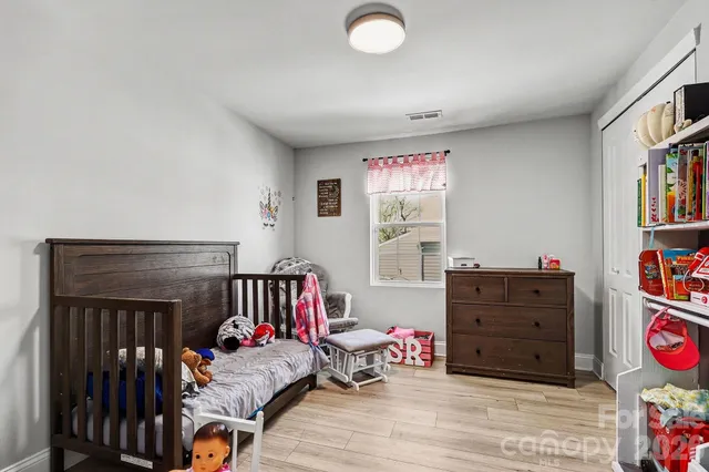 a bathroom with a sink a toilet and a shower curtain
